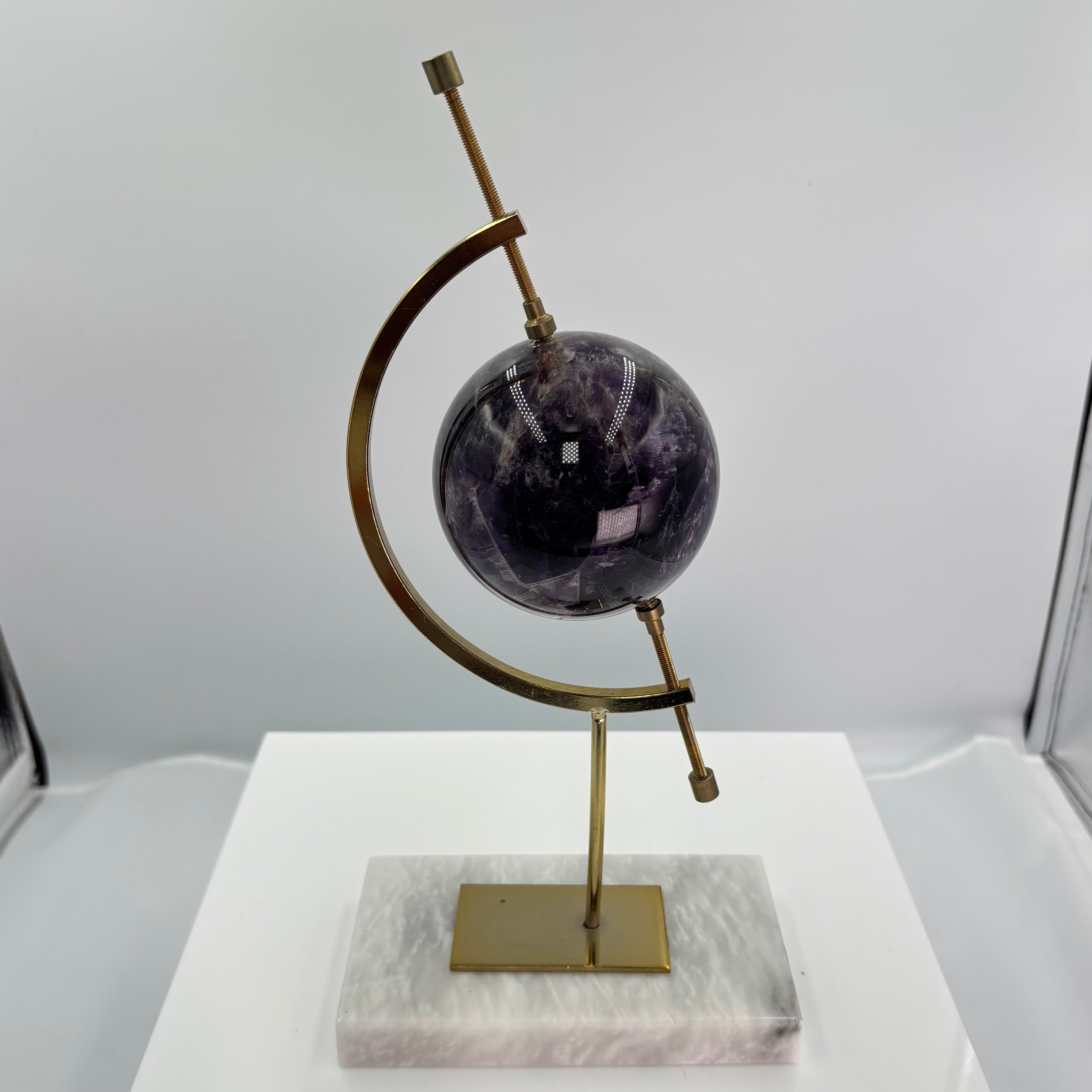 Amethyst globe on marble base